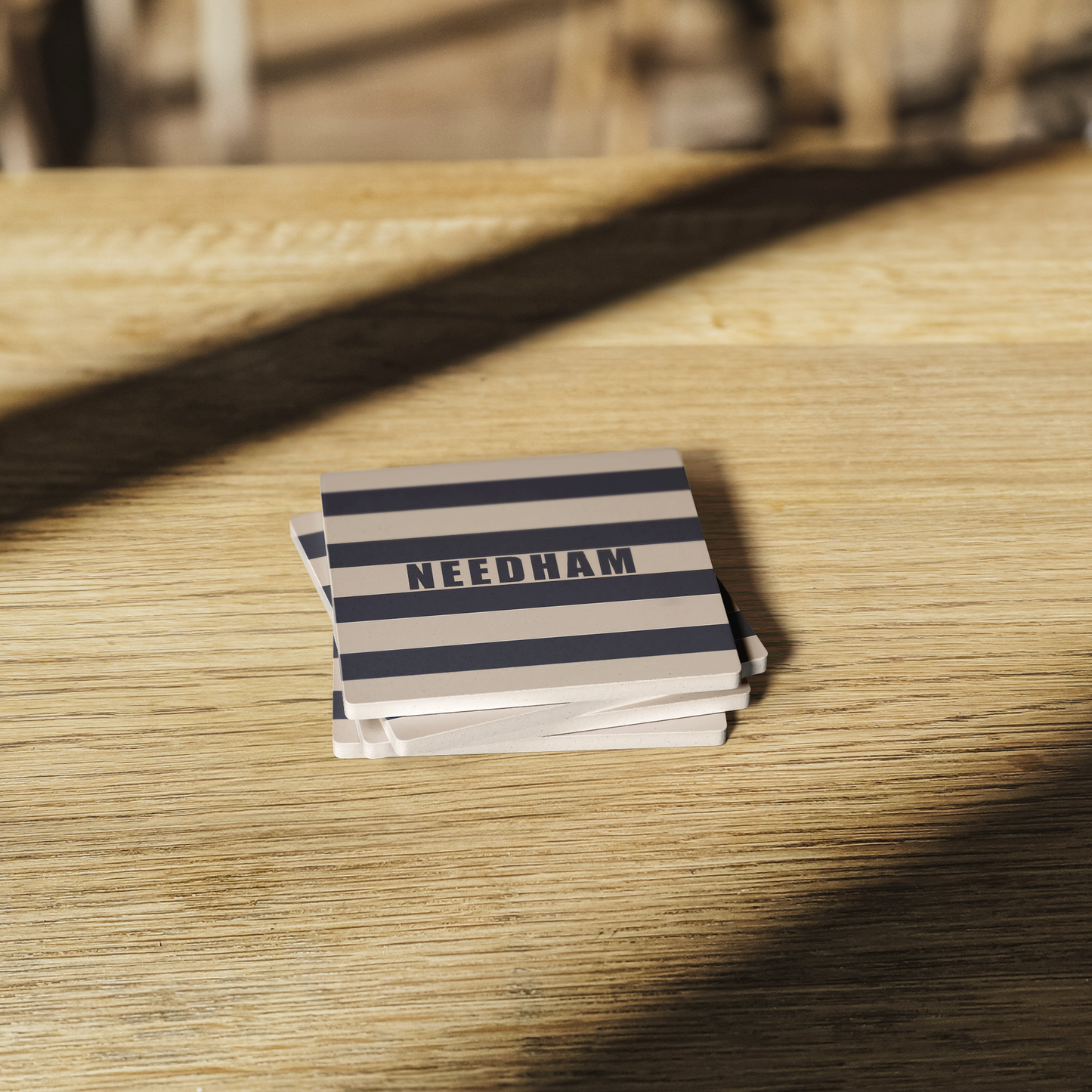 The_Namesake_Striped_Stone_Coasters_SquareStoneCoaster_WoodTable_AS_Mockup.png